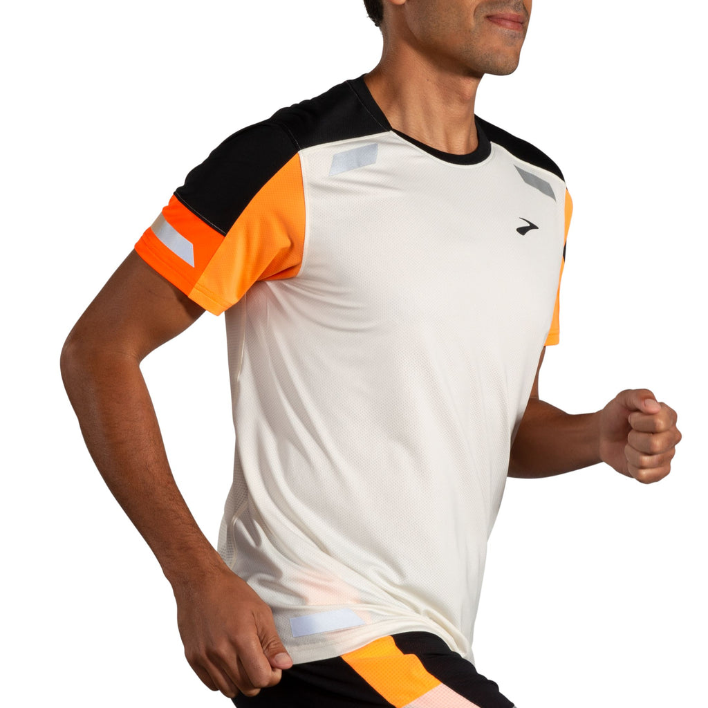 Men's Brooks Run Visible Short Sleeve 2.0. Black/White/Orange. Lateral view.