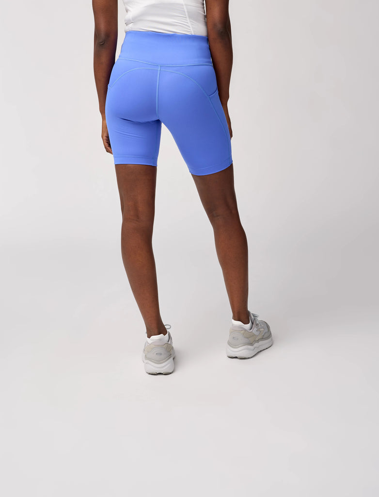 Women's Brooks Spark 8" Short Tights. Light Blue. Rear view.