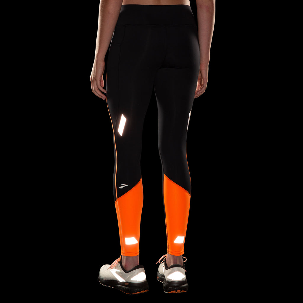 Women's Brooks Run Visible Tight 2.0. Black/Orange. Rear view.