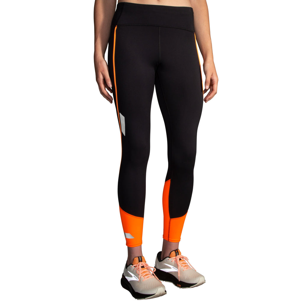 Women's Brooks Run Visible Tight 2.0. Black/Orange. Front view.