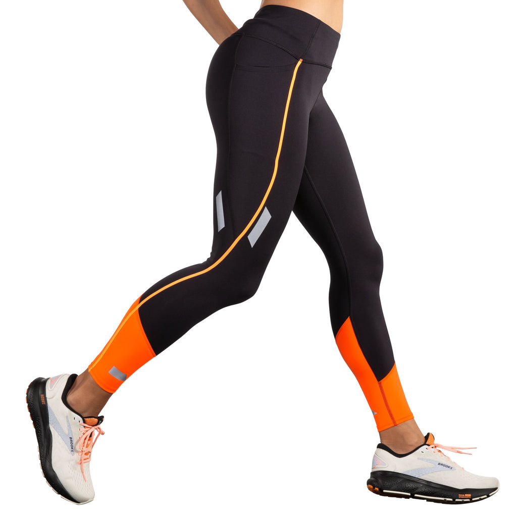 Women's Brooks Run Visible Tight 2.0. Black/Orange. Lateral view.