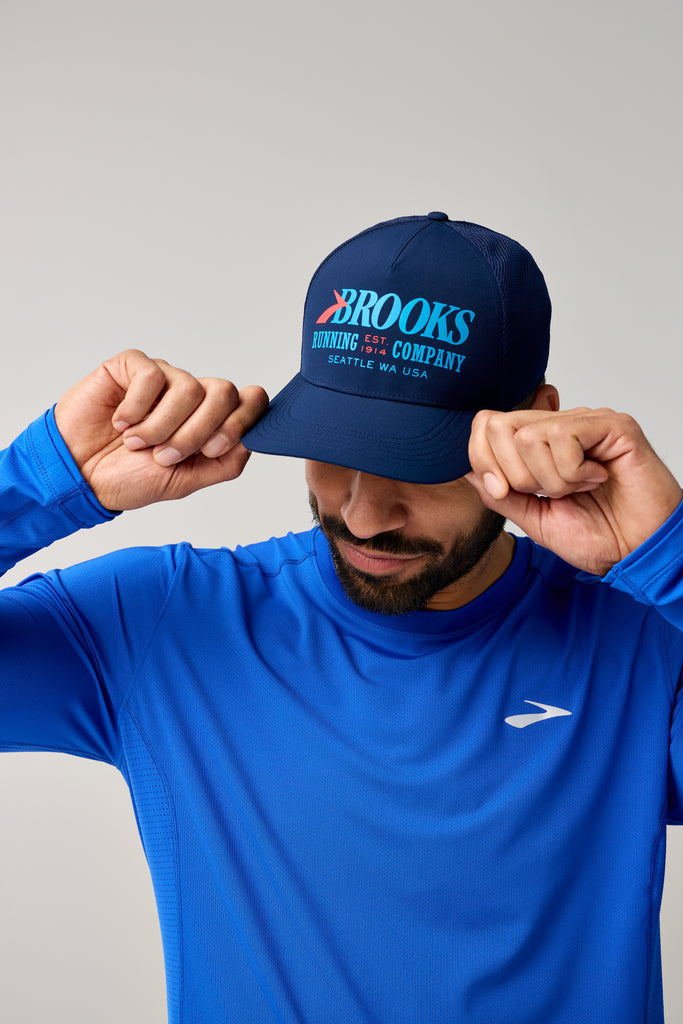 Brooks Surge Trucker Hat. Blue. Front view.