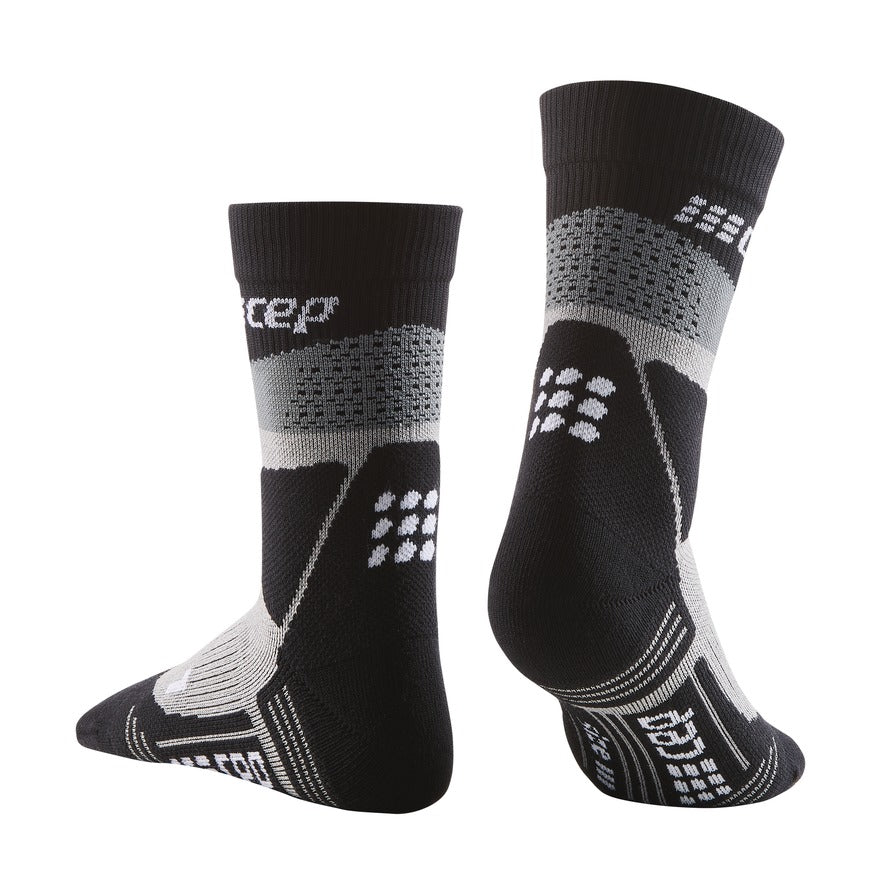 Women's CEP Max Cushion Mid Cut Socks. Black. Rear/Lateral view.