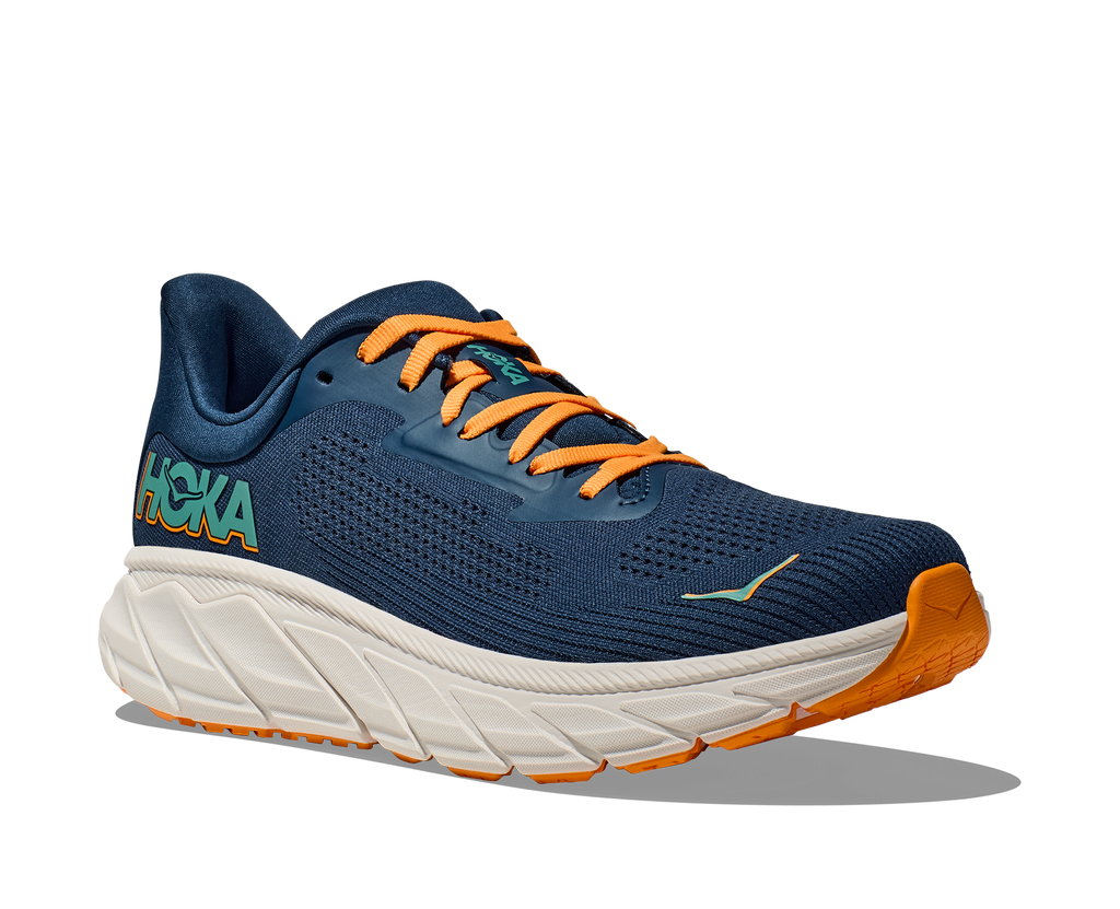 Men's Hoka Arahi 7. Dark Blue upper. Off white midsole. Lateral view.