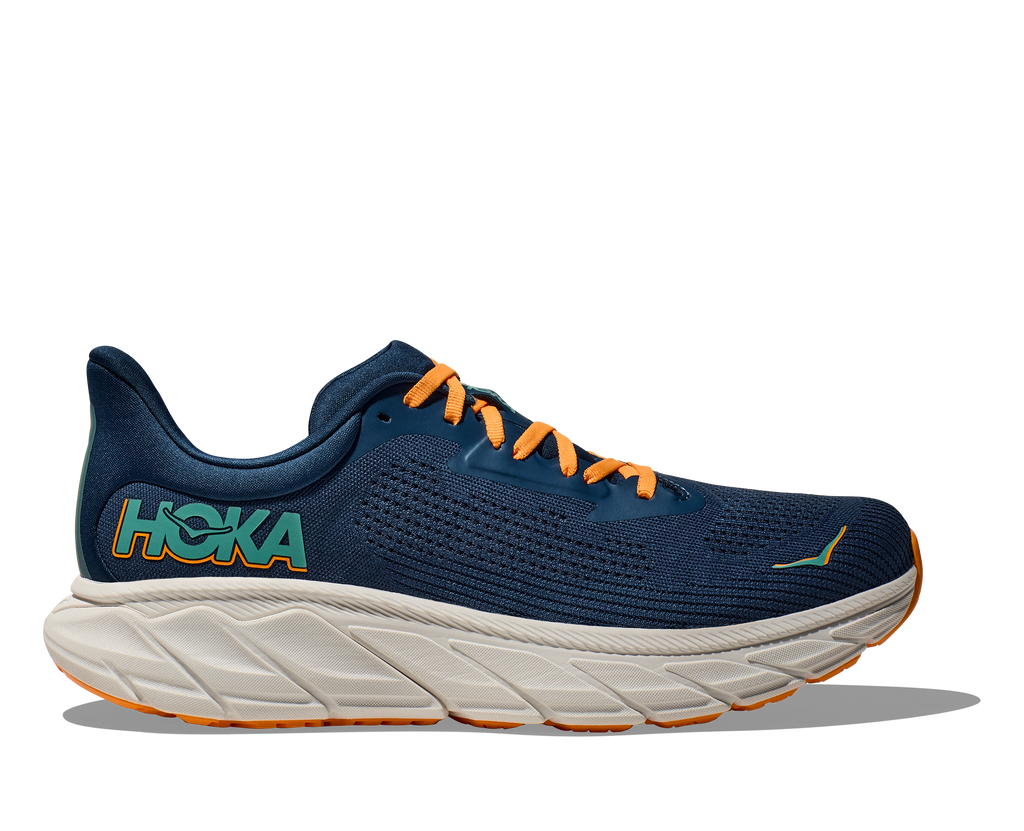 Men's Hoka Arahi 7. Dark Blue upper. Off white midsole. Lateral view.