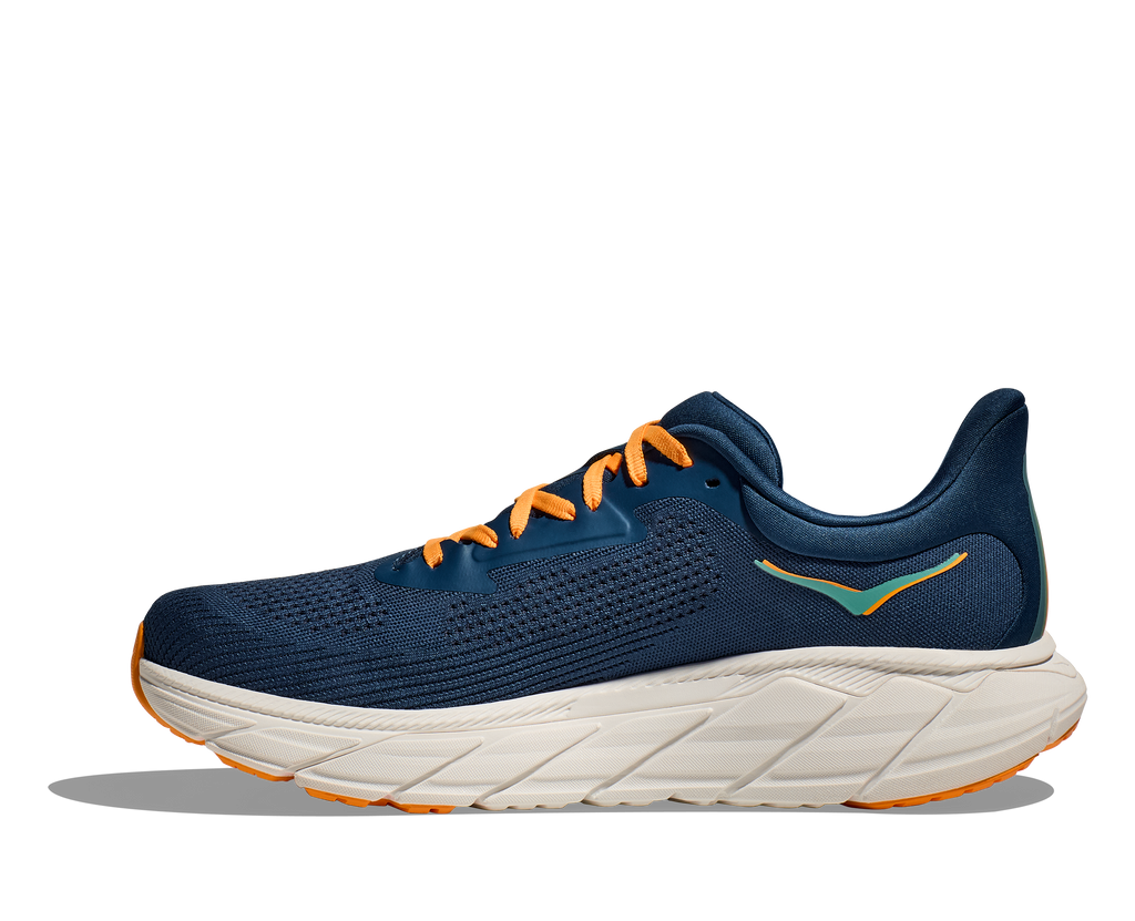 Men's Hoka Arahi 7. Dark Blue upper. Off white midsole. Medial view.