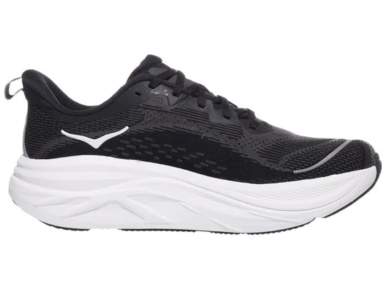 Men's Hoka Skyflow. Black upper. White midsole. Medial view.