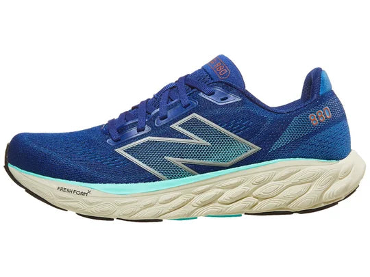 Men's New Balance 880 V14. Blue upper. Off white midsole. Lateral view.