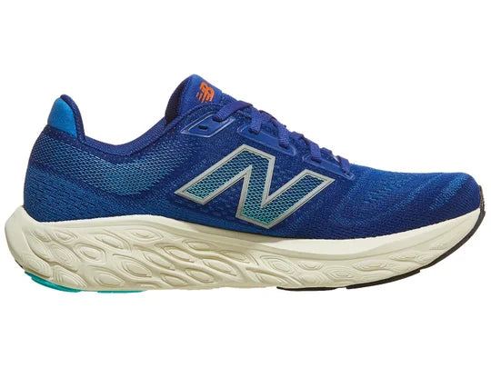 Men's New Balance 880 V14. Blue upper. Off white midsole. Medial view.