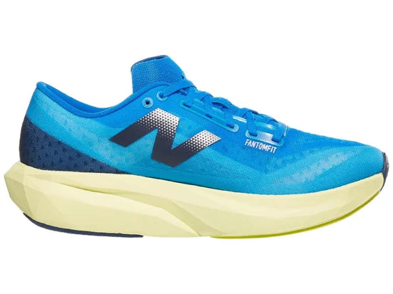 Men's New Balance FuelCell Rebel v4. Blue upper. Green midsole. Medial view.