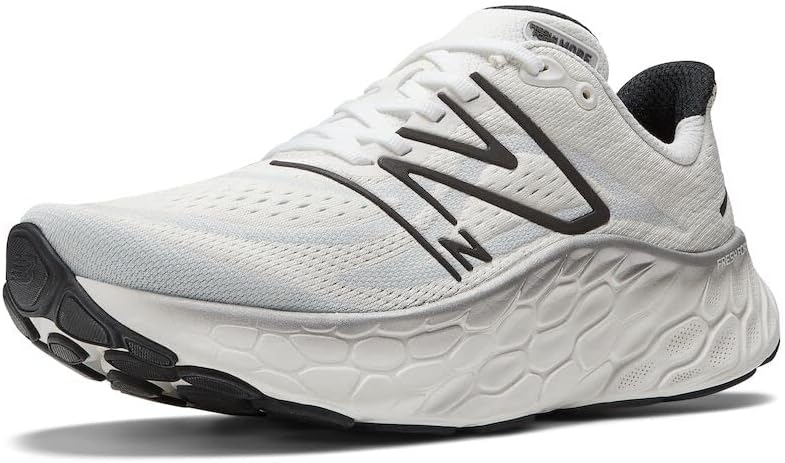 Men's New Balance More v4. White upper. White midsole. Lateral view.