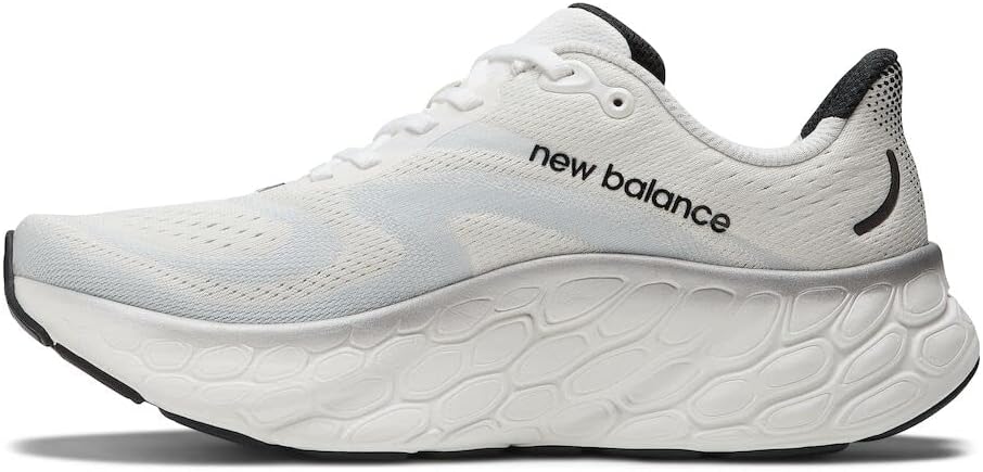 Men's New Balance More v4. White upper. White midsole. Medial view.