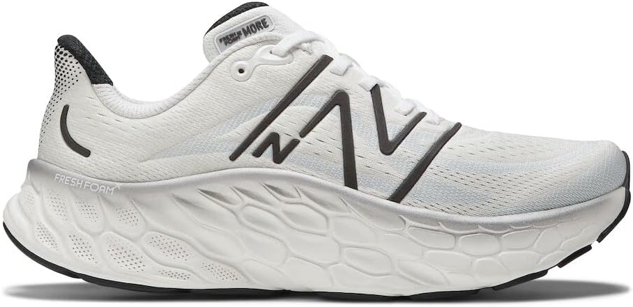 Men's New Balance More v4. White upper. White midsole. Lateral view.