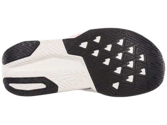 Men's New Balance FuelCell Rebel v5. Off white and brown upper. Off white and brown midsole. Bottom view.
