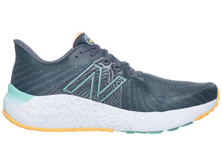 Men's New Balance Vongo V5. Grey upper. White/Green midsole. Medial view.