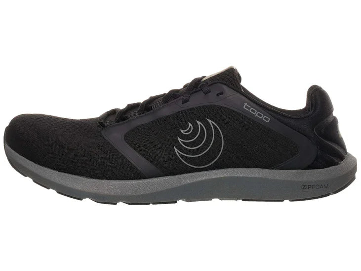 Men's Topo Athletic ST-5. Black upper. Dark grey midsole. Lateral view.