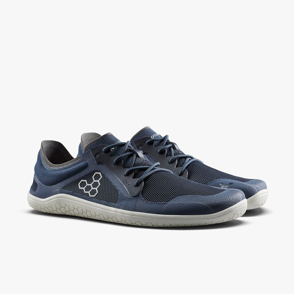 Men's Viviobarefoot Primus Lite 3.5. Navy blue upper. White midsole. Lateral view.