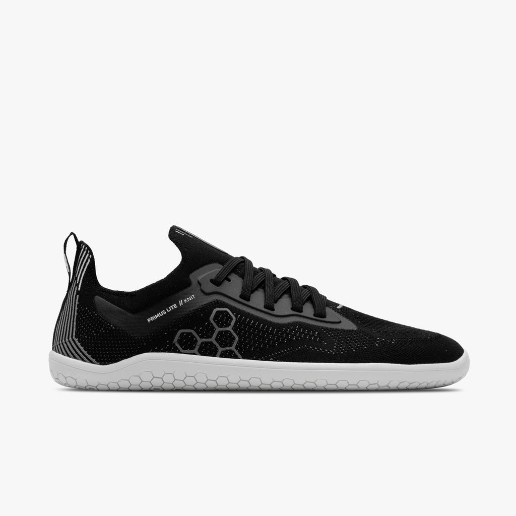 Men's Vivobarefoot Primus Lite Knit. Black upper. White outsole. Lateral view.