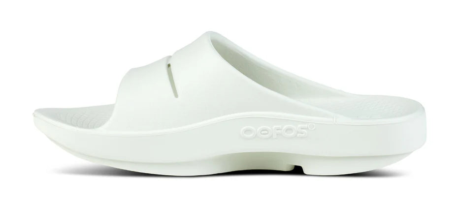 Oofos Ooahh Slide. Light Gray. Medial view.