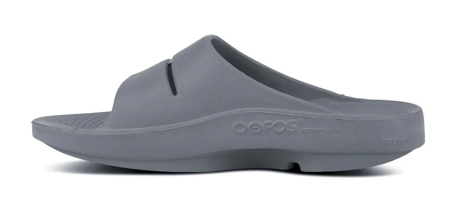 Oofos Ooahh Slide. Gray. Medial view.