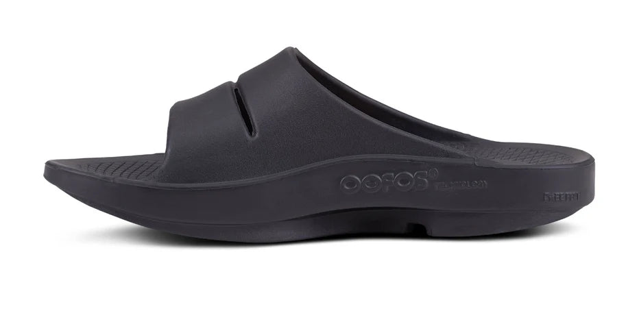 Oofos Ooahh Sport Slides. Black. Medial view.