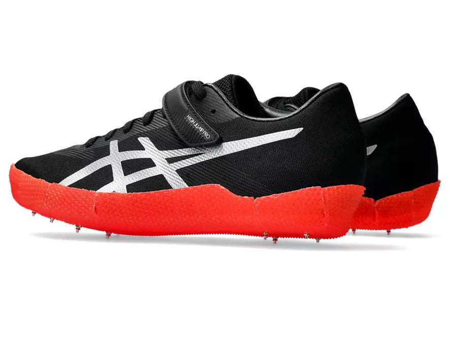 Unisex Asics High Jump Pro Left. Black upper. Red midsole. Lateral view.