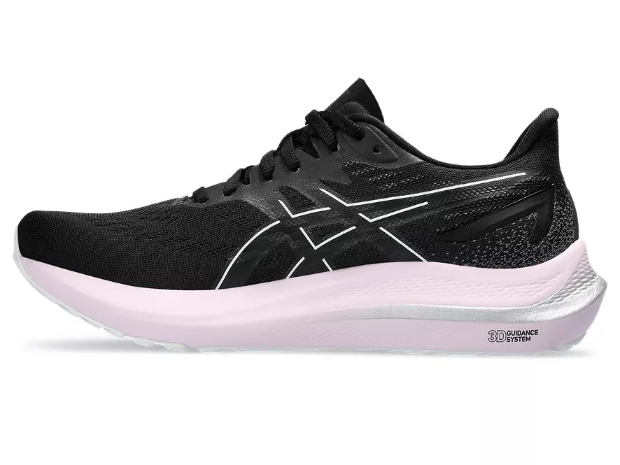 Women's Asics GT 2000 12. Black upper. White midsole. Medial view.