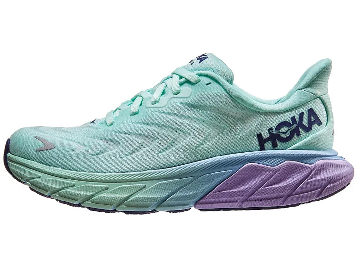 Women's Hoka Arahi 6. Light green upper. Light green/purple midsole. Lateral view.