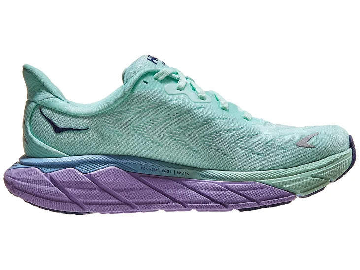 Women's Hoka Arahi 6. Light green upper. Light green/purple midsole. Medial view.