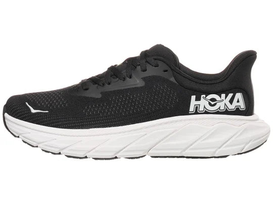 Women's Hoka Arahi 7. Black upper. White midsole. Lateral view.