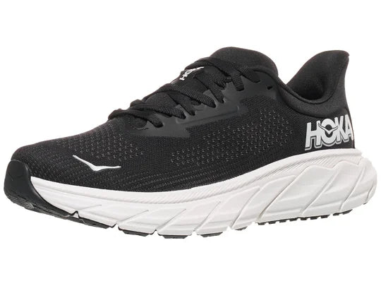 Women's Hoka Arahi 7. Black upper. White midsole. Lateral view.