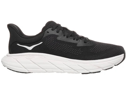 Women's Hoka Arahi 7. Black upper. White midsole. Medial view.