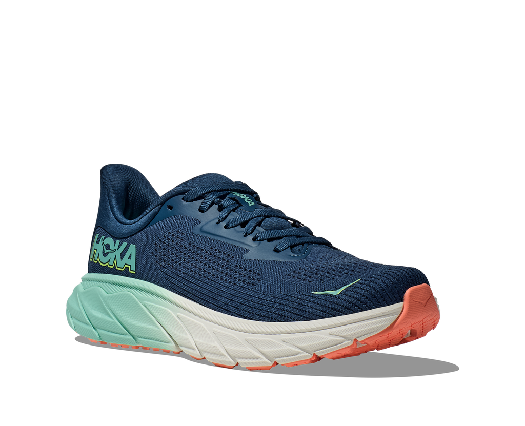 Women's Hoka Arahi 7. Dark Blue upper. Light Green midsole. Lateral view.