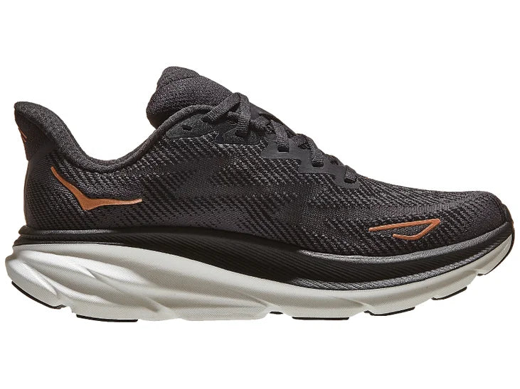 Women's Hoka Clifton 9. Black upper. Black/Grey midsole. Medial view.