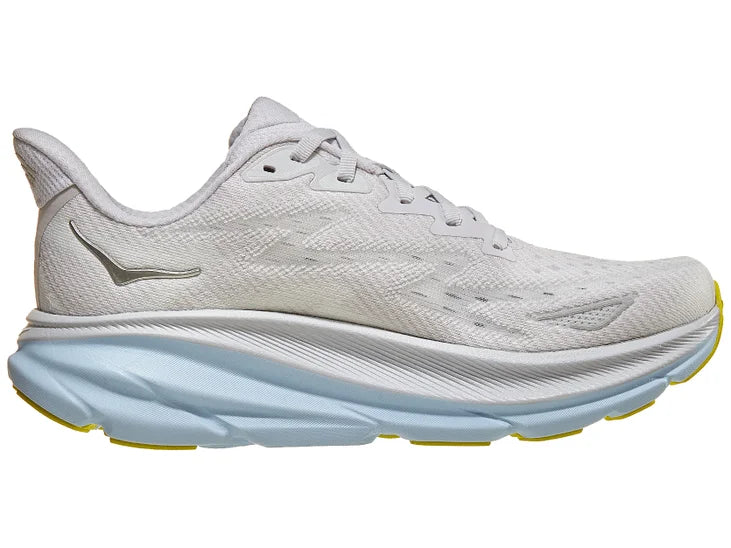 Women's Hoka Clifton 9. White upper. Light blue/White midsole. Medial view.