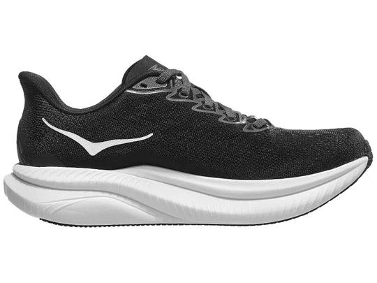 Women's Hoka Mach 6. Black upper. White midsole. Medial view.