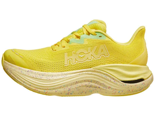 Women's Hoka Skyward X. Yellow upper. Speckled midsole. Lateral view.