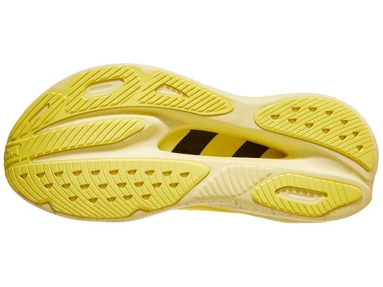 Women's Hoka Skyward X. Yellow upper. Speckled midsole. Bottom view.