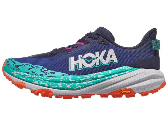 Women's Hoka Speedgoat 6. Blue upper. Grey midsole. Lateral view.