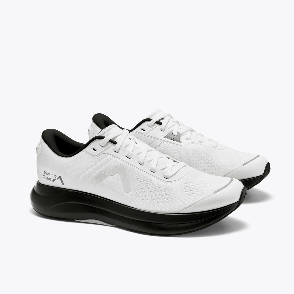Women's Mount to Coast P1. White upper. Black midsole. Lateral view.