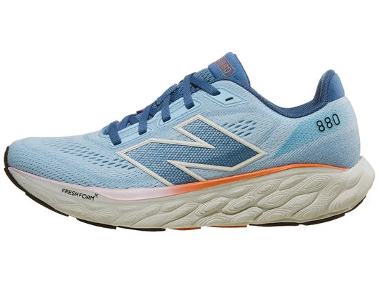 Women's New Balance 880 V14. Blue upper. Off White midsole. Lateral view.