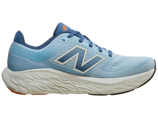 Women's New Balance 880 V14. Blue upper. Off White midsole. Medial view.