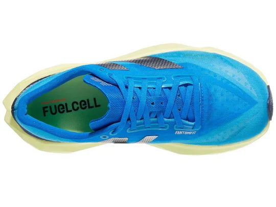 Women's New Balance FuelCell Rebel v4. Blue upper. Green midsole. Top view.