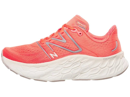 Women's New Balance More V4. Light Red upper. White midsole. Lateral view.