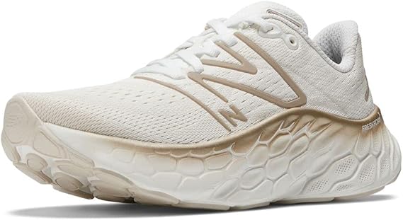 Women's New Balance More v4. White upper. White midsole. Lateral view.