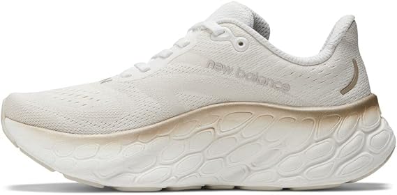 Women's New Balance More v4. White upper. White midsole. Medial view.