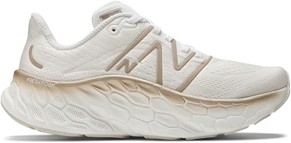 Women's New Balance More v4. White upper. White midsole. Lateral view.