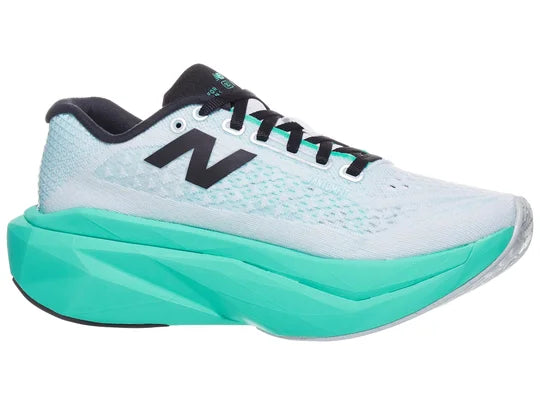 Women's New Balance SuperComp Trainer V3. White upper. Green midsole. Medial view.