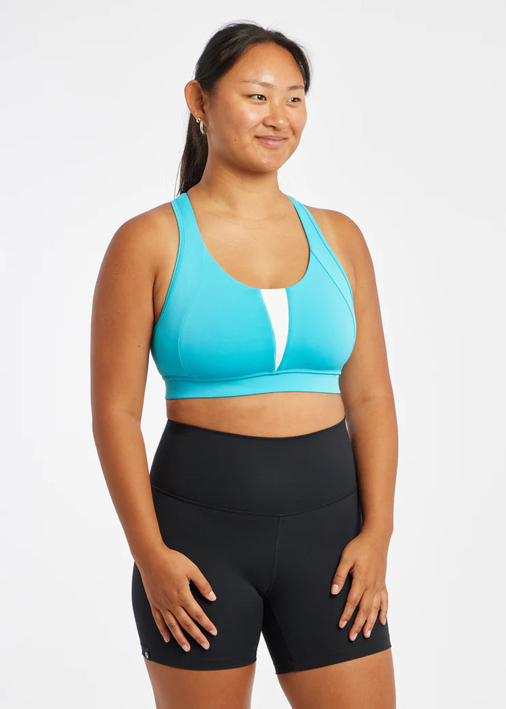 Women's Oiselle Double Breasted Bra. Blue/Green. Front view.