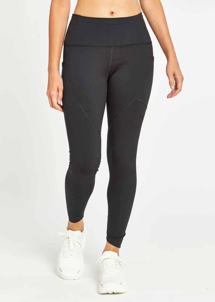 Women's Oiselle Flyout Tights. Black. Front view.